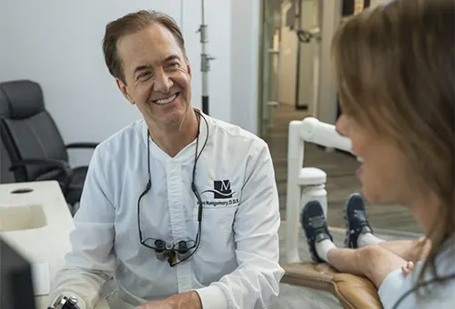Dr. Montgomery talking a patient through her cosmetic treatment.